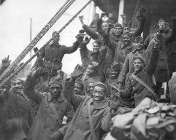 group of jubilant Black soldiers, “Harlem Hellfighters” of 369th Regiment